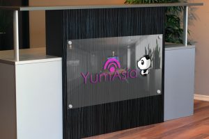 Yum Asia logo on a desk