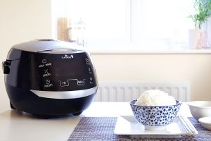 Sakura ceramic rice cooker on a table with rice