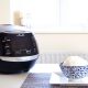 Sakura ceramic rice cooker on a table with rice